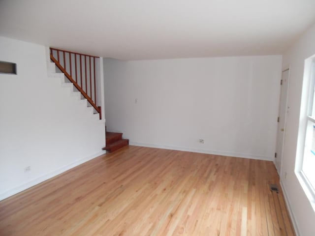 spare room with light wood-type flooring