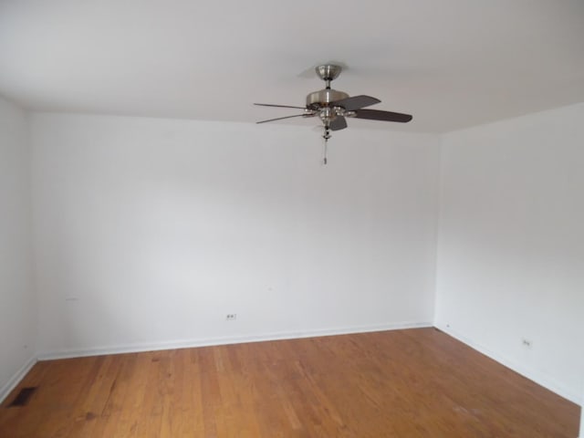 empty room featuring ceiling fan and wood-type flooring