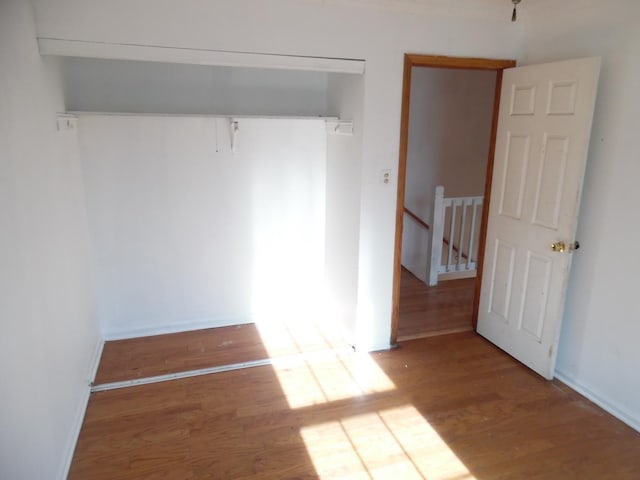 unfurnished room with light wood-type flooring