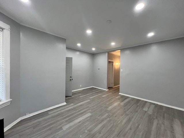 unfurnished room featuring recessed lighting, baseboards, and wood finished floors