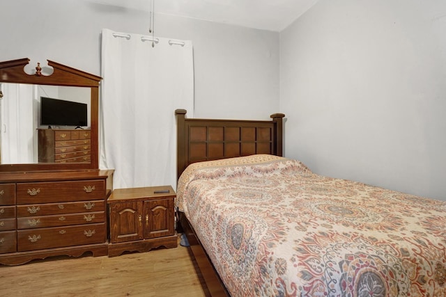 bedroom with light hardwood / wood-style flooring