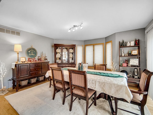 dining room with light hardwood / wood-style floors