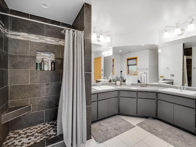 bathroom featuring walk in shower, vanity, and tile patterned floors