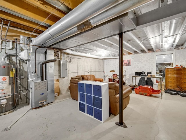 basement featuring water heater, electric panel, and heating unit