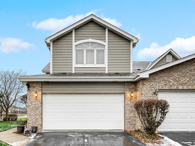 front of property with a garage