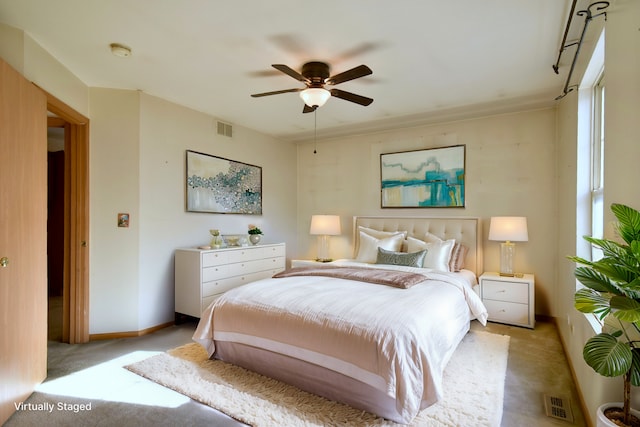 carpeted bedroom featuring ceiling fan