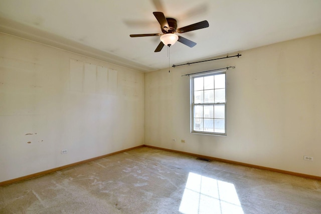 empty room with light carpet and ceiling fan