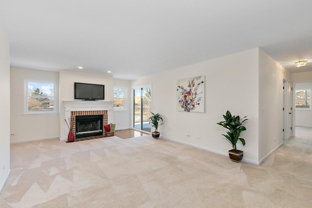 living room featuring a brick fireplace and light carpet