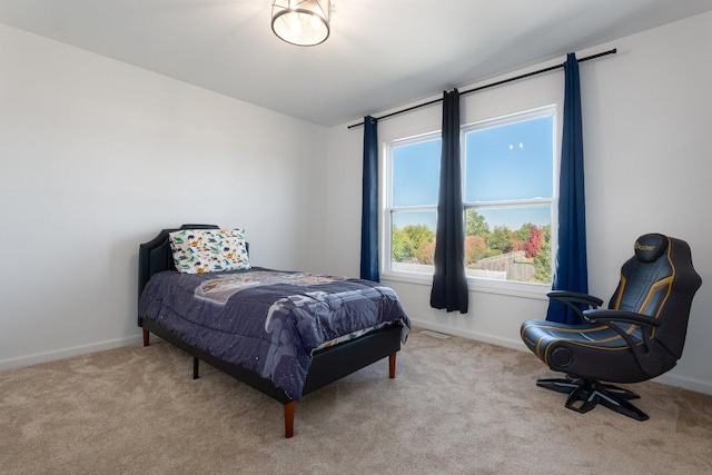 bedroom with light colored carpet