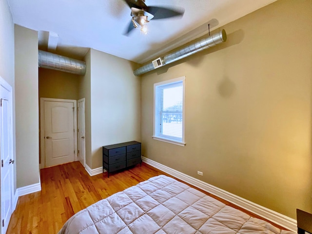 bedroom featuring ceiling fan and light hardwood / wood-style flooring