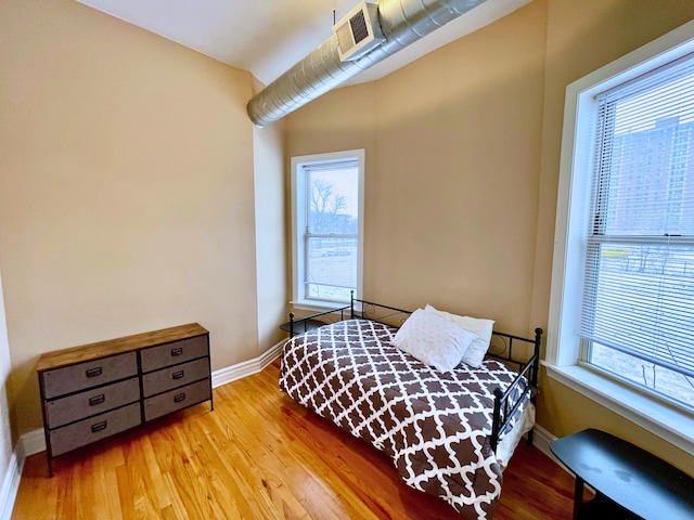 bedroom with light hardwood / wood-style floors