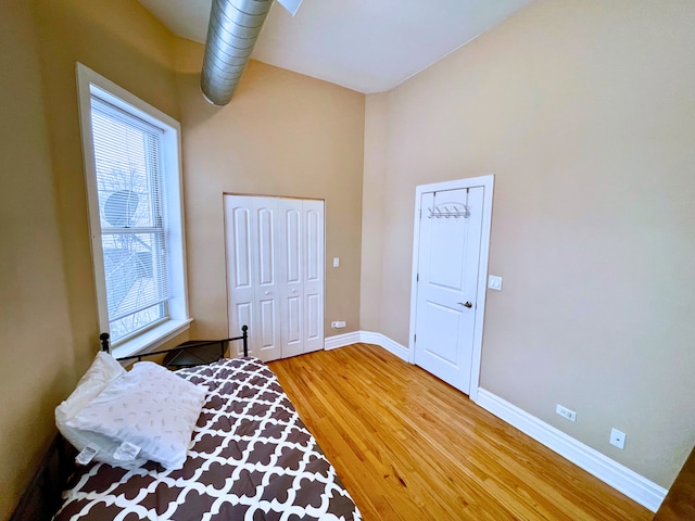 bedroom with hardwood / wood-style floors