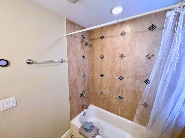 bathroom featuring shower / bath combo with shower curtain