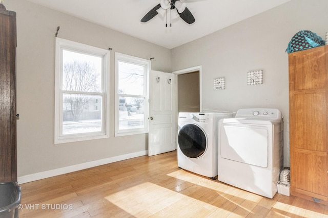 laundry room featuring ceiling fan, separate washer and dryer, and light hardwood / wood-style floors