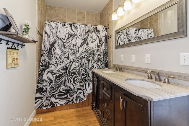 bathroom featuring wood-type flooring and vanity