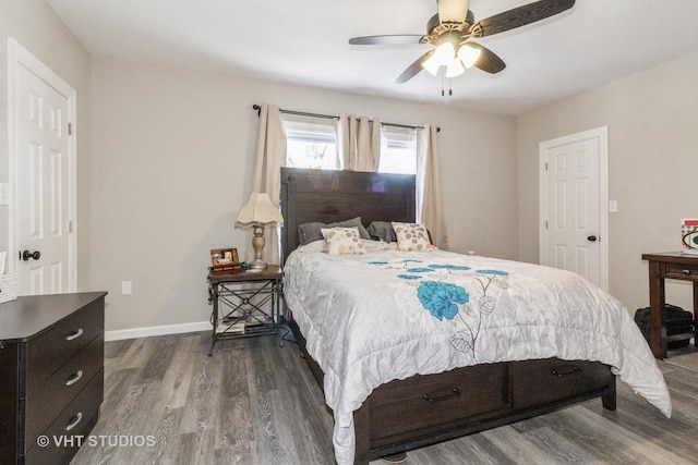 bedroom with hardwood / wood-style flooring and ceiling fan