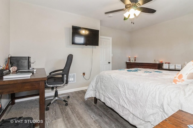 bedroom featuring dark wood-type flooring and ceiling fan