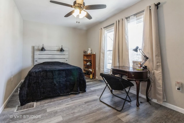 bedroom with hardwood / wood-style flooring and ceiling fan