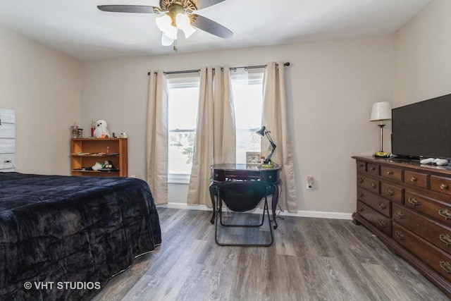 bedroom featuring hardwood / wood-style flooring and ceiling fan