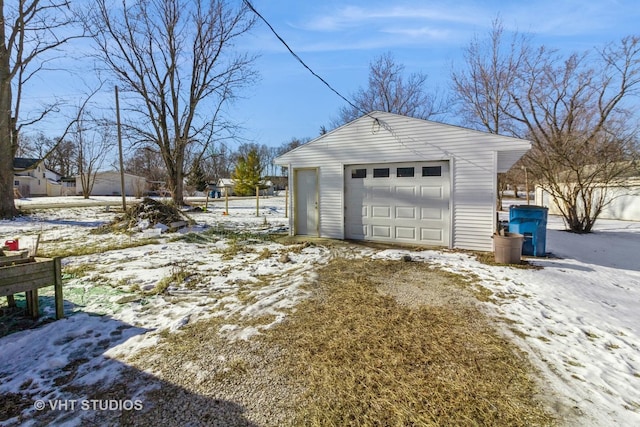 view of snow covered garage