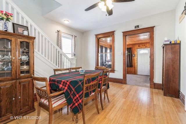 dining area featuring light hardwood / wood-style floors and ceiling fan