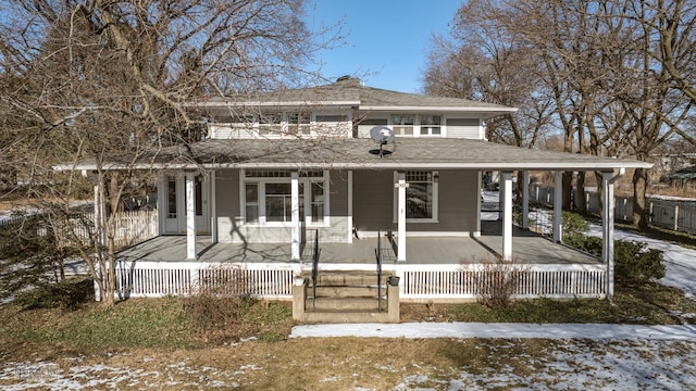 farmhouse featuring covered porch