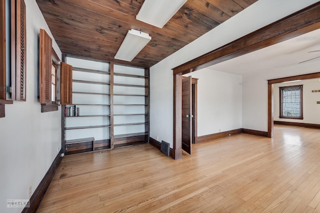 additional living space with wood ceiling and light hardwood / wood-style floors