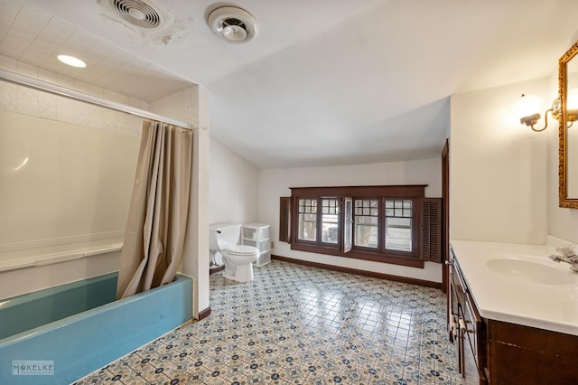 full bathroom featuring toilet, vanity, and shower / tub combo with curtain