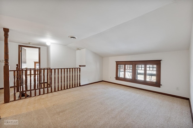 bonus room featuring carpet floors and vaulted ceiling