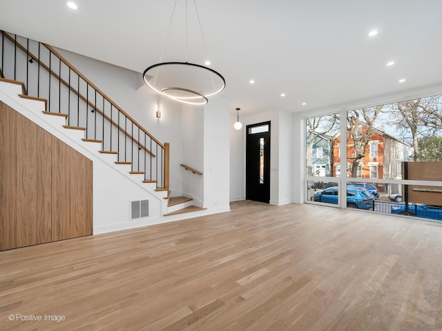 unfurnished living room featuring light hardwood / wood-style floors