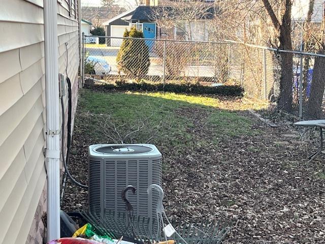 view of yard featuring central air condition unit