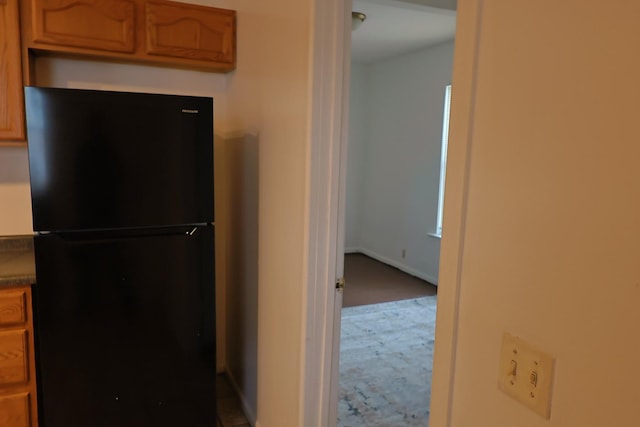 kitchen with black refrigerator