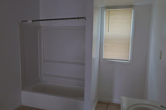 bathroom featuring shower / tub combination and tile patterned floors