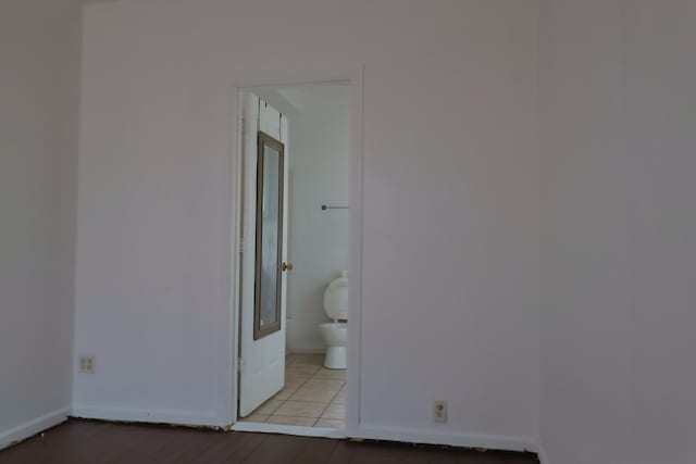 interior space with connected bathroom and light wood-type flooring