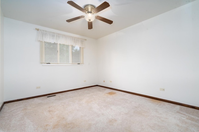 carpeted empty room with ceiling fan