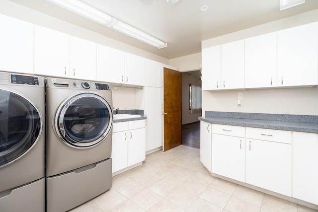 washroom with cabinets and separate washer and dryer