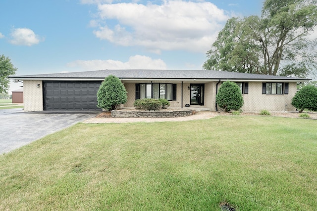 single story home featuring a garage and a front lawn