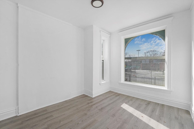 spare room with light wood-type flooring