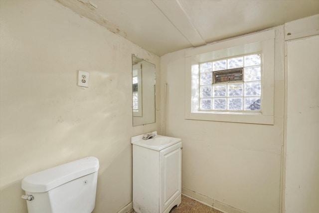 bathroom with toilet and vanity