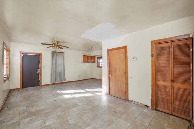 spare room with ceiling fan