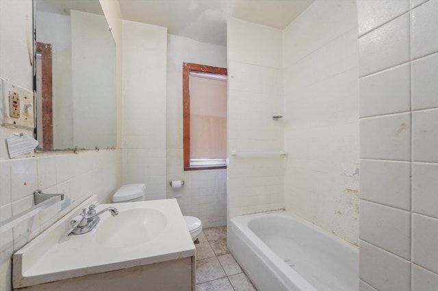 bathroom with toilet, tile patterned flooring, tile walls, and a bath