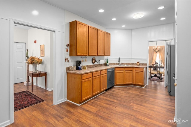 kitchen featuring dark hardwood / wood-style floors, sink, and appliances with stainless steel finishes