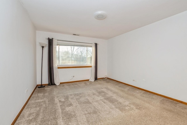 empty room featuring light carpet