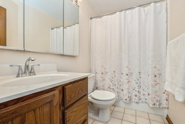 bathroom with toilet, curtained shower, tile patterned floors, and vanity