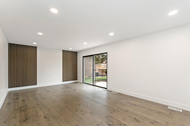 spare room featuring hardwood / wood-style flooring