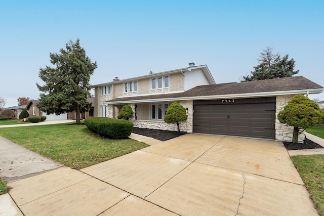 view of front property with a front yard and a garage