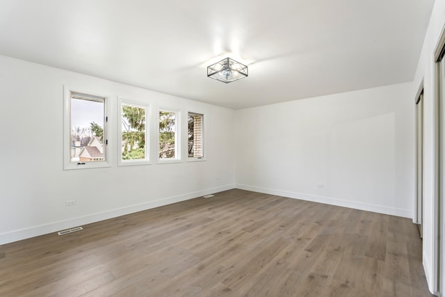 empty room featuring wood-type flooring