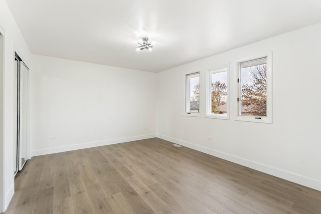 spare room featuring light hardwood / wood-style floors