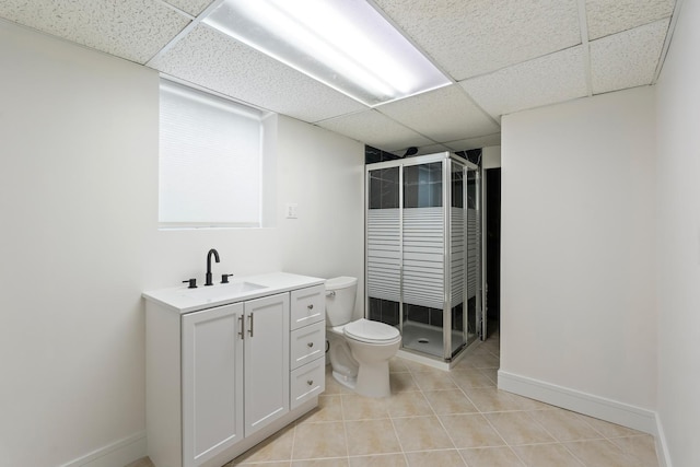 bathroom with vanity, a paneled ceiling, and walk in shower