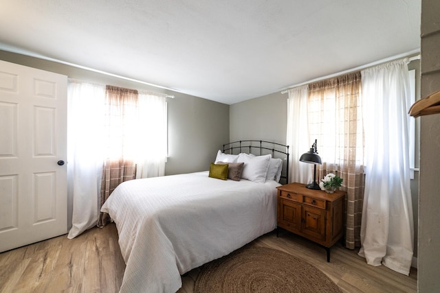 bedroom with light hardwood / wood-style floors